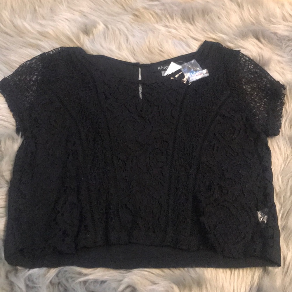 Black lace front crop top. Brand New with Tags